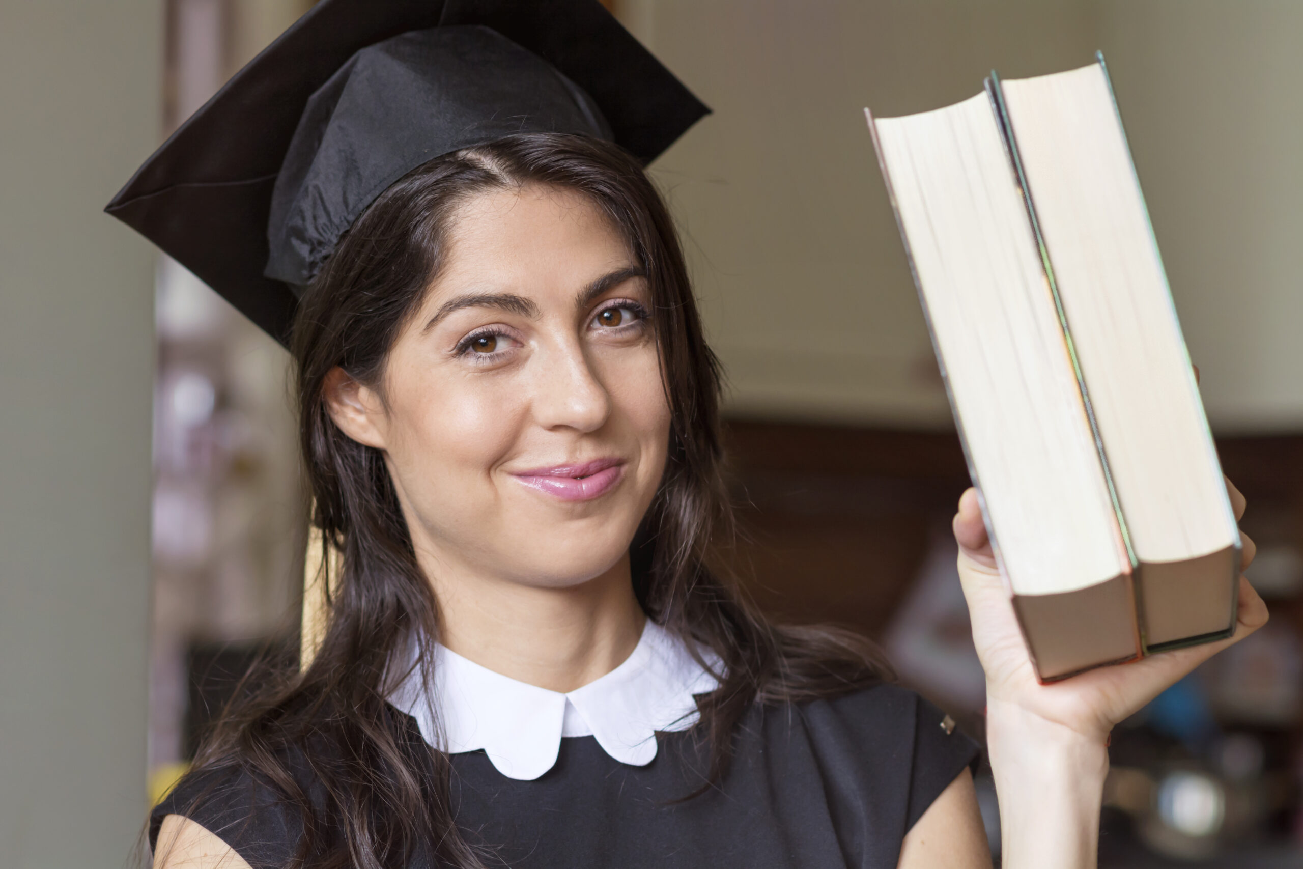 close-up-girl-showing-two-books